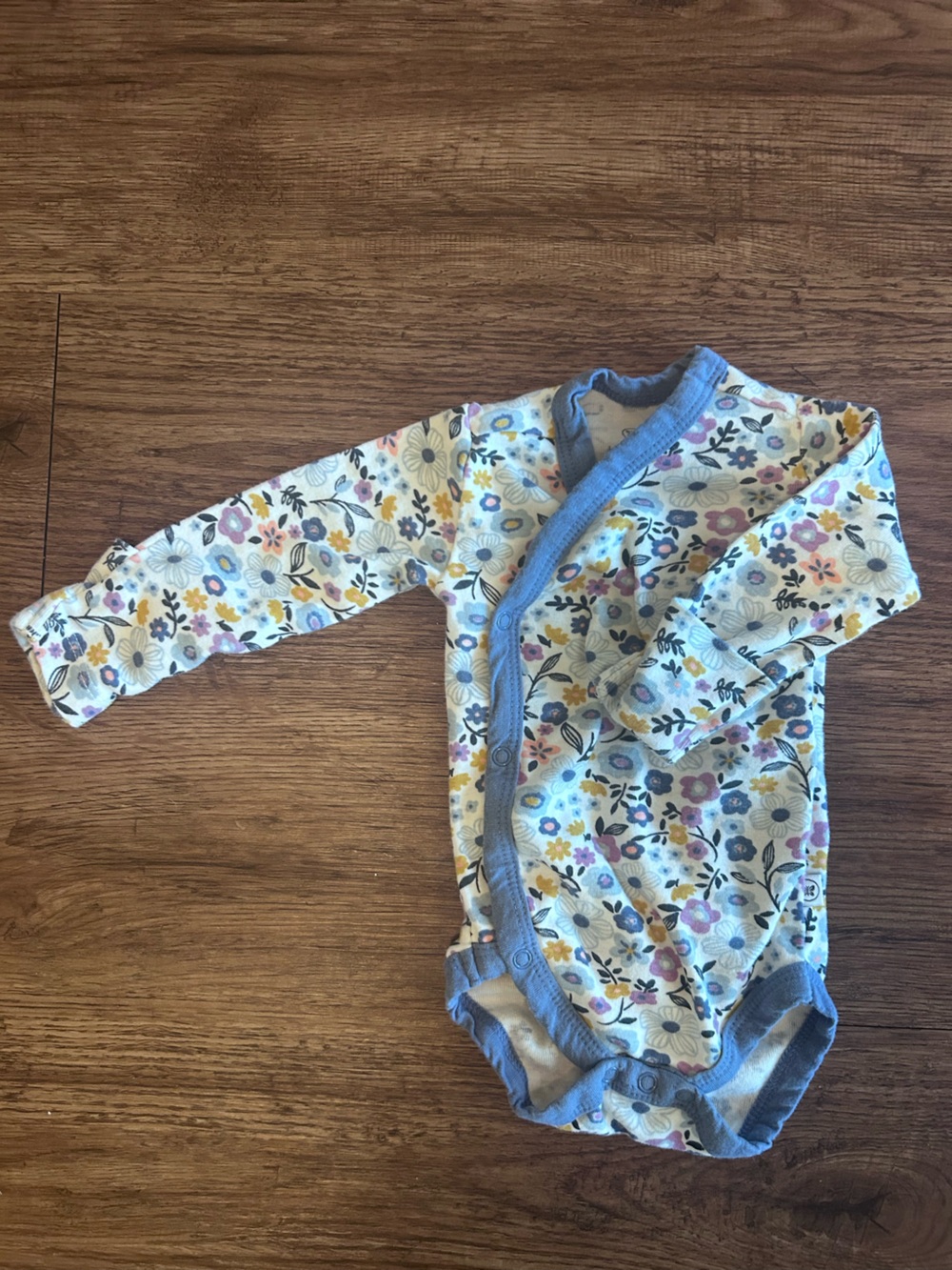 The Honest Company Floral Long Sleeve Baby Bodysuit with Blue Trim